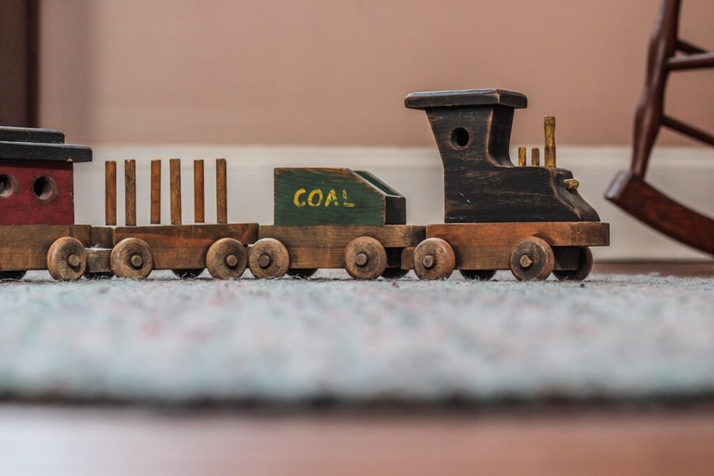 Wooden toy train on a rug